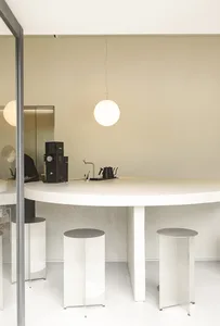 White concrete kitchen with minimalist design and functional features.