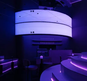 Industrial-themed casino interior with concrete walls and lighting.