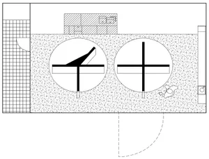 Floor plan of a modern building with concrete flooring and circular features.