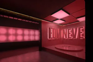 A modern, industrial-themed entertainment venue with illuminated signage and metallic elements.