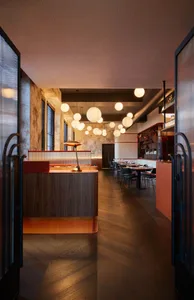Industrial-style restaurant interior with metal, wood, and concrete elements