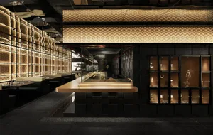 A minimalist restaurant interior with concrete and wooden elements.