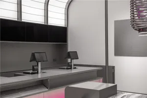 A modern, minimalist restaurant counter with a concrete finish and sleek, industrial design.