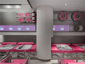 A modern restaurant interior featuring plastic tables, marble counters, tea pots, and posters.