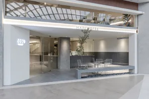 Modern coffee shop with concrete and glass interior materials