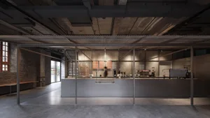 Concrete coffee shop counter with industrial design elements.