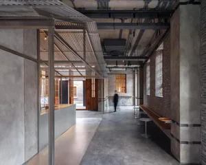 Industrial-style commercial space with concrete and metal elements.