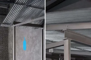 Modern, industrial-style metal outdoor canopy with perforated metal panels and structural support beams.