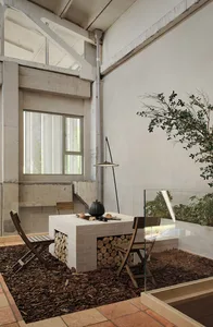 Industrial-style workspace with brick fireplace and glass enclosure
