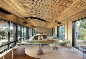 Interior view of a modern cafe featuring timber elements and a spacious, airy atmosphere.