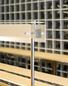 Modern office interior with industrial design elements featuring metal and glass materials.