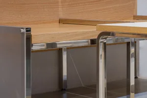 Detailed view of modern office space with steel and wood elements.