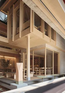 Modern restaurant exterior with a wooden facade and large glass windows.