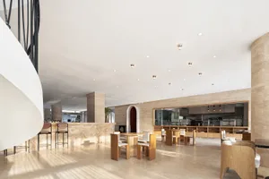 Modern restaurant interior with marble flooring and countertops