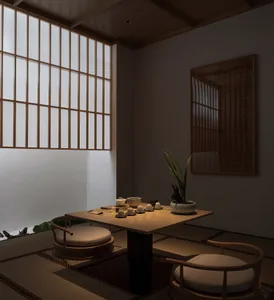 A traditional Japanese tea room with tatami mats, wooden furniture, and a tea set on the table.