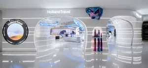 Interior of a minimalist travel agency with metallic and white design elements.