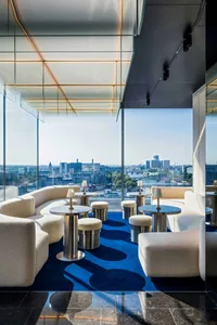 Modern hotel lobby featuring a combination of marble and fabric elements.