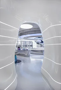 A modern retail space with curved metallic and glass structures