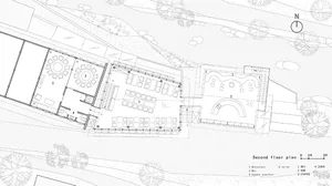 Second floor plan of a restaurant-inn showing various sections and furniture layout.