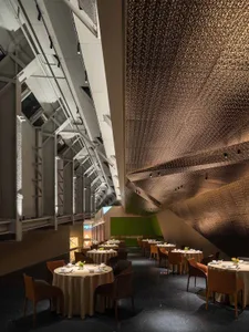 A modern restaurant interior featuring a metal ceiling.