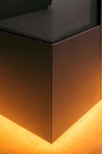 Modern interior design featuring metallic elements with orange lighting