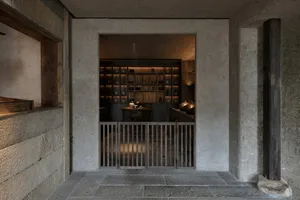 Concrete walls and floor of a minimalist industrial restaurant interior