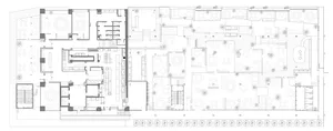 Floor plan of a modern office space featuring various rooms and areas including conference rooms, workstations, and an open p