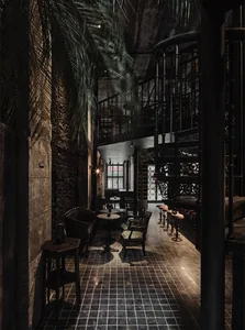 Industrial-style coffee shop interior with concrete walls and furnishings.