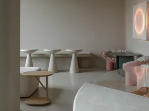 Minimalist restaurant interior with concrete tables and benches