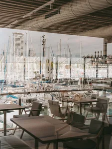 Modern restaurant interior with metallic tables and chairs