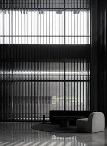 Modern lobby featuring metallic furniture and a minimalist design aesthetic.