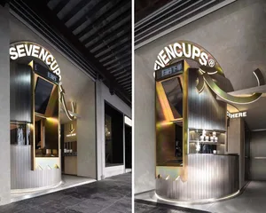 Modern retail storefront with metallic counter and concrete flooring
