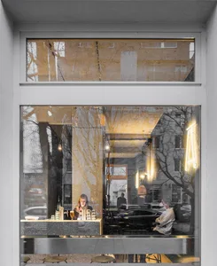 A modern coffee shop interior with a glass window