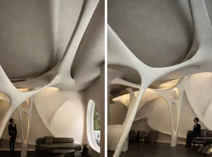Modern interior space with concrete cellular structures and minimalist decor.