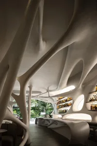 An interior design featuring modern concrete structures in a restaurant bar setting.