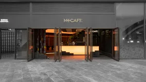 Modern interior of a cafe with glass, metal, and stone materials