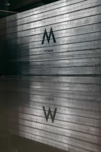 Metal storefront with the letters M and W