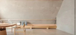 A minimalist interior space featuring marble and wood materials.