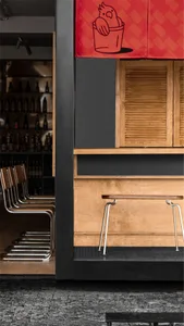 Wooden panels and minimalist furniture in a modern cafe setting.