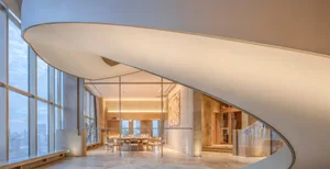 Modern lobby area with glass walls and concrete flooring