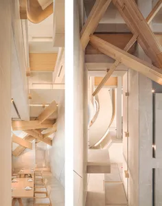 Modern restaurant interior with wooden beams and concrete tiles