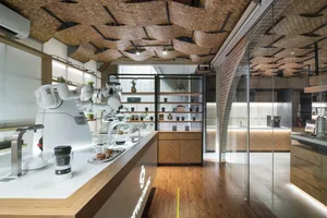 An industrial-style coffee shop featuring bamboo and wood elements.
