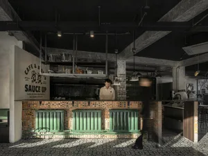 現代工業風咖啡廳室內，擁有磚牆、混凝土地板與金屬元素。