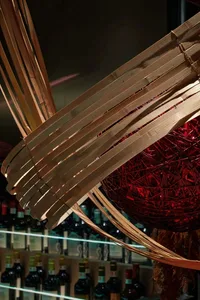 Bamboo woven lighting fixture hanging in a restaurant interior