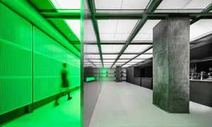 A modern office space with concrete walls and flooring.