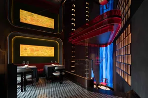 A modern restaurant interior featuring acrylic lighting and mixed materials.