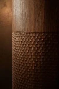 A modern interior space featuring intricate wood carvings.