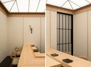 Modern restaurant interior featuring wooden tables and minimalist design.