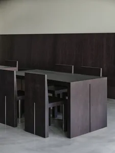 A modern dining room with dark wooden tables and chairs, modern design furniture, minimalist interior design, dark wooden flo