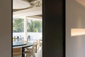 Industrial restaurant interior with metallic counter and chairs